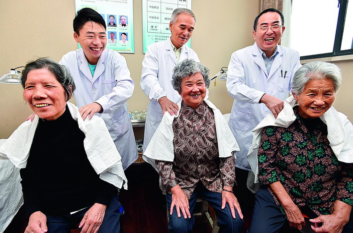 October 9, 2016: Health workers perform physical therapy on seniors in Yangzhou City, Jiangsu Province. By the end of 2017, China was home to 241 million seniors aged 60 and above, accounting for more than 17 percent of its total population. VCG